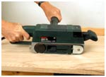 Remove any glue and blemishes on the faces of the boards with a belt sander